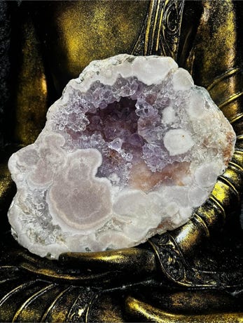 A small oblong pink amethyst cave from Brazil