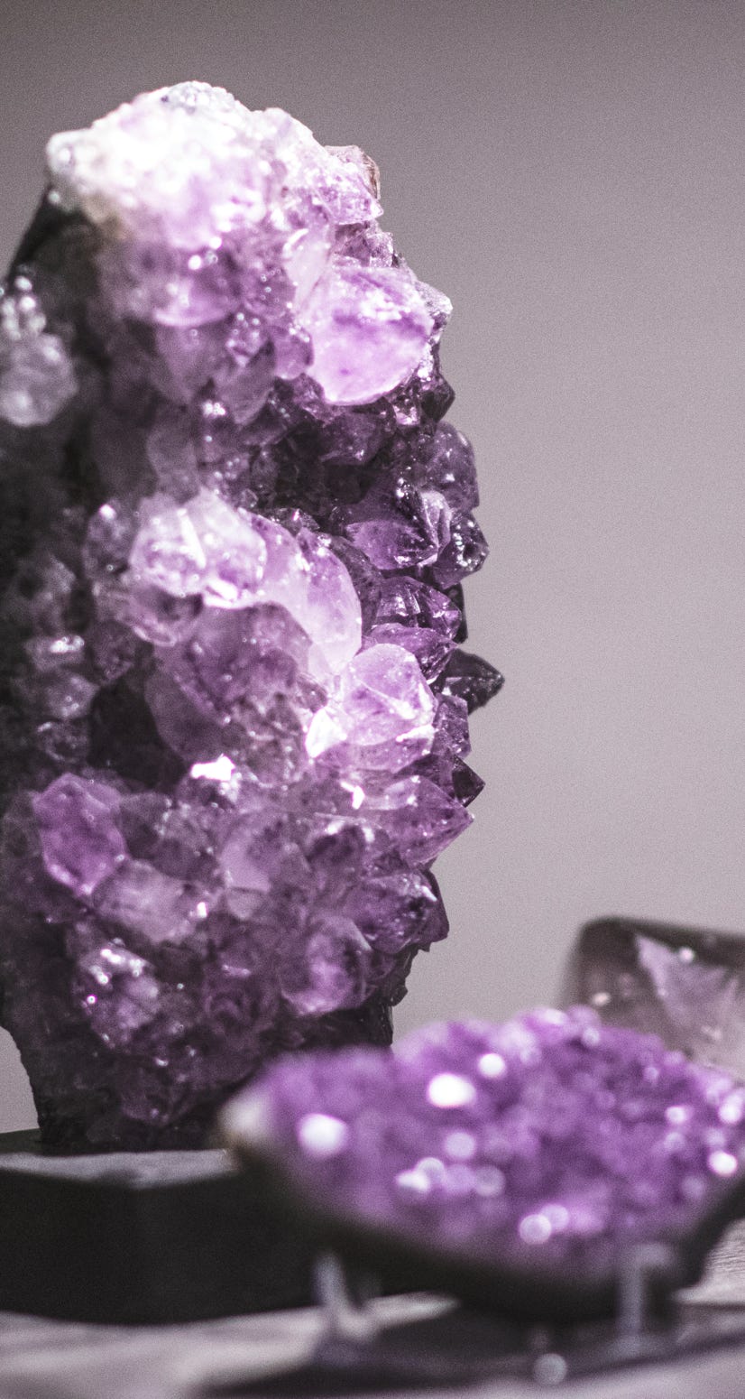 Two striking amethyst cluster, one upright tower the second one on its side