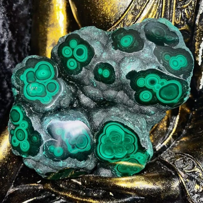 Like bubbled lava from a rock, this malachite is a statment piece from the Congo