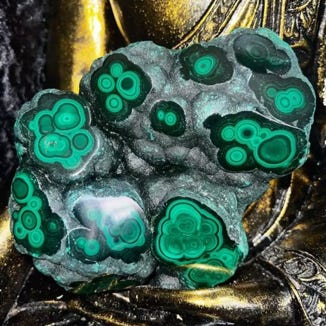 Like bubbled lava from a rock, this malachite is a statemtn piece