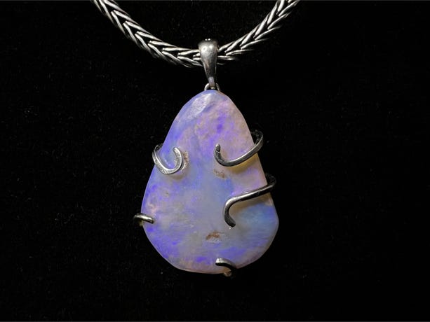 A beautiful striking luminescent Lightning Ridge opal pendant